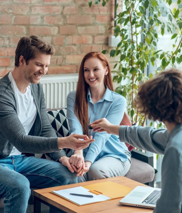 broker-giving-buyer-real-estate-key-1.jpg